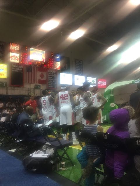 Members of the Maine Red Claws confer during a timeout.